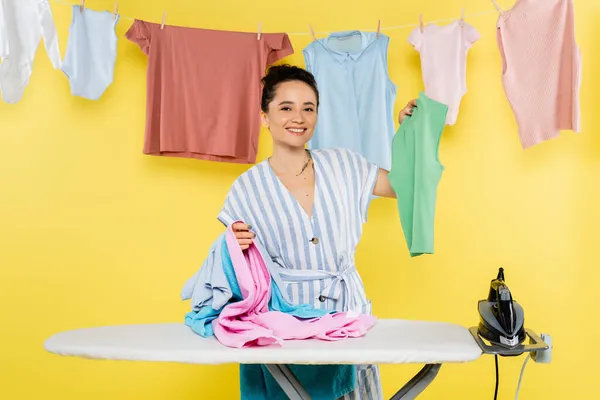 Cheerful Housewife Looking Camera While Holding Clothes Ironing Board Yellow — Stock Photo, Image