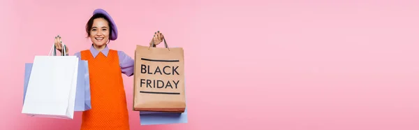 Smiling Woman Holding Purchases Shopping Bag Black Friday Lettering Isolated — Stock Photo, Image