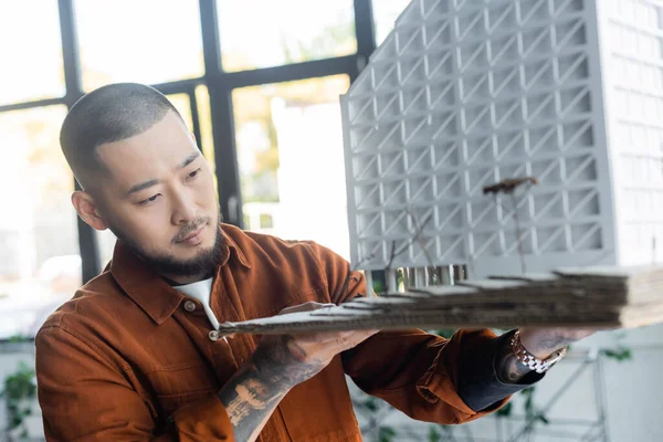 Asian Architect Holding Blurred House Model While Working Office — Stock Photo, Image