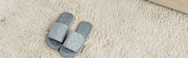 High Angle View Grey Slippers Beige Carpet Banner — Stock Photo, Image