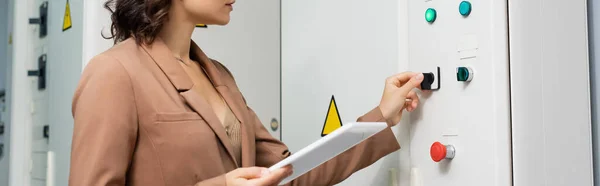 Cropped View Engineer Holding Digital Tablet While Pushing Button Switchboard — Stock Photo, Image