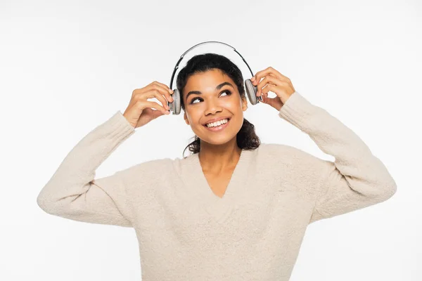 Cheerful African American Woman Sweater Holding Headphones Isolated White — Stock Photo, Image
