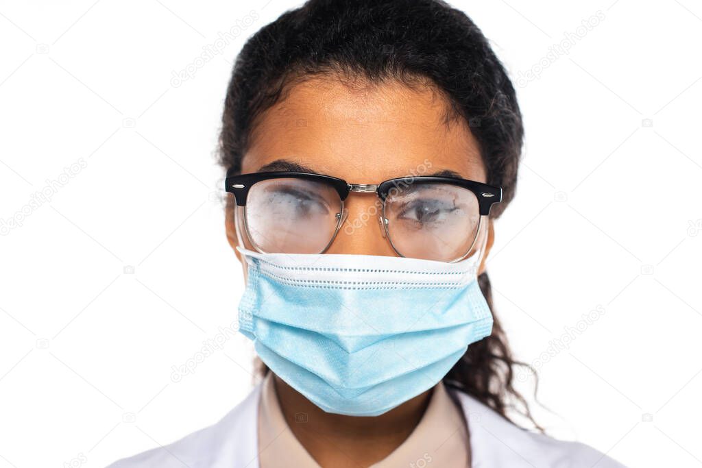 African american doctor in medical mask and fogged eyeglasses isolated on white 