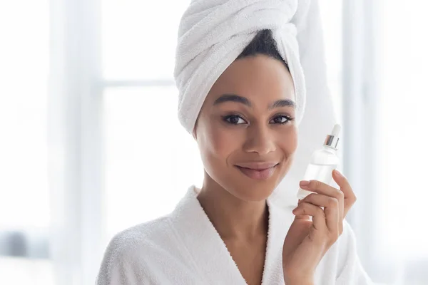 Smiling African American Woman Bathrobe Holding Serum Home — Stock Photo, Image