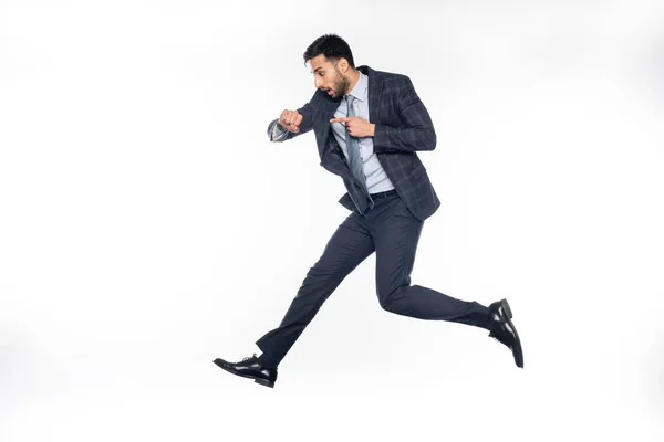 Businessman Suit Levitating While Pointing Wristwatch White — Stock Photo, Image