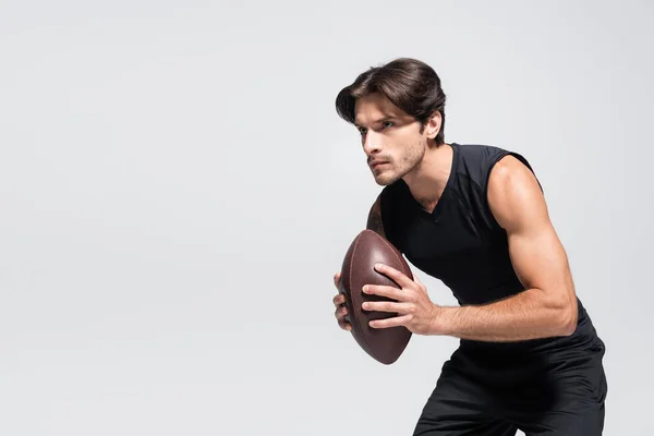 Brunette Sportsman Holding Rugby Ball While Playing Isolated Grey — Stockfoto