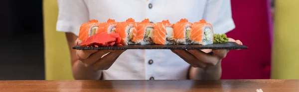 Partial View Woman Holding Plate Tasty Sushi Rolls Banner — Fotografia de Stock