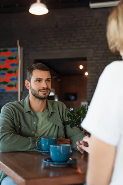 Young Man Blurred Woman Holding Hands Coffee Cups Cafe — Stock Photo, Image