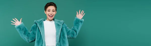 Excited Woman Faux Fur Jacket Waving Hands While Looking Camera — стоковое фото