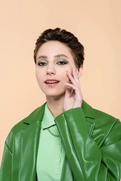 Young Brunette Woman Leather Jacket Touching Face While Looking Camera — Stock Photo, Image