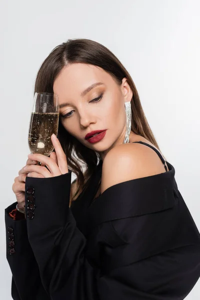 Seductive Brunette Woman Black Blazer Holding Glass Champagne Isolated Grey — Stock Photo, Image