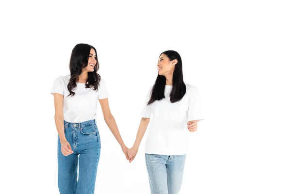 Cheerful Interracial Women Holding Hands Looking Each Other Isolated White — Stockfoto