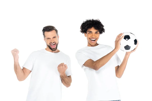 cheerful african american man holding soccer ball near friend shouting and showing  success gesture isolated on white