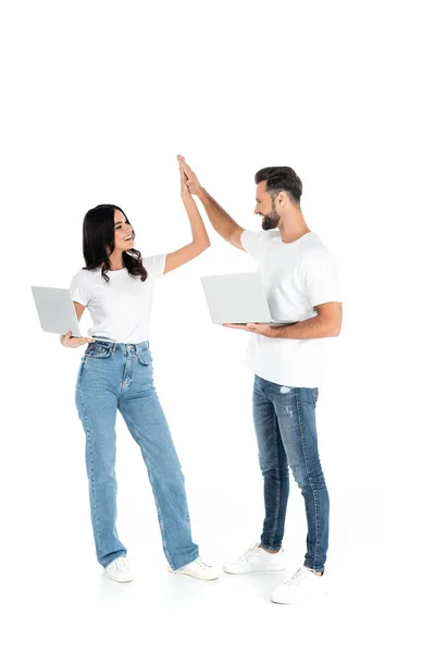 Full Length View Pleased Couple Laptops Looking Each Other Giving — Stock Photo, Image