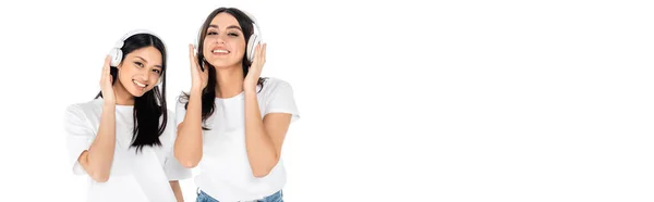 Pleased Interracial Woman Smiling Camera While Listening Music Headphones Isolated — Fotografia de Stock