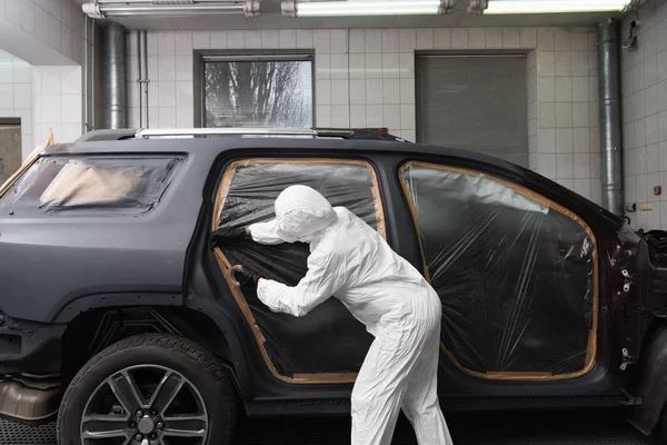 Workwoman Protective Suit Applying Tape Car Service — Zdjęcie stockowe