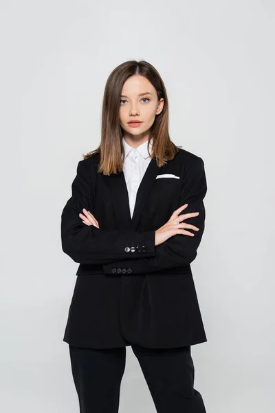 Stylish Woman Suit Standing Crossed Arms Isolated Grey — Stock Fotó