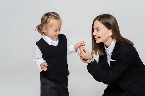 Joyful Mother Holding Hands Disabled Daughter Isolated Grey — Foto de Stock