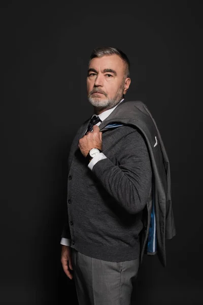Stylish Senior Man Holding Blazer Looking Camera Grey — Stockfoto