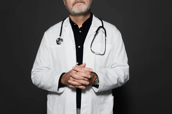 Cropped View Senior Doctor Stethoscope Neck Standing Clasped Hands Isolated — Foto de Stock