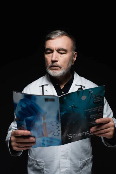 Bearded Physician White Coat Reading Science Magazine Isolated Black — Stock Photo, Image