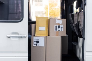 Cardboard boxes with symbols in car 