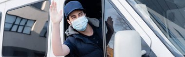Delivery man in medical mask waving hand while driving auto, banner 