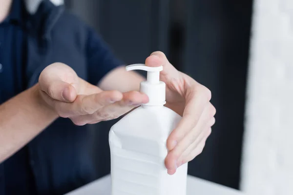 Cropped View Courier Applying Hand Sanitizer Office —  Fotos de Stock