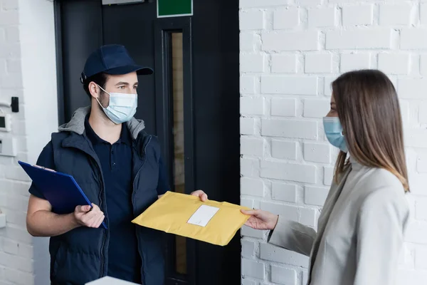 Businesswoman Medical Mask Taking Parcel Courier Clipboard Office — Stock Photo, Image