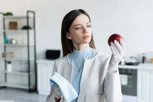 Young Woman Latex Gloves Holding Apple Rag Kitchen — Fotografia de Stock