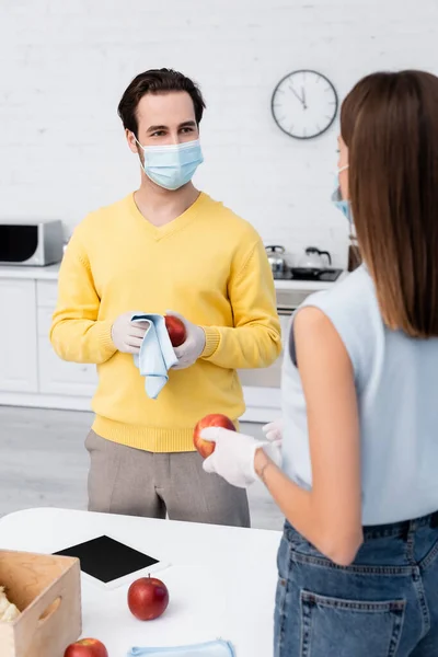 Man Latex Gloves Cleaning Apple Digital Tablet Blurred Girlfriend Medical — Stock Photo, Image