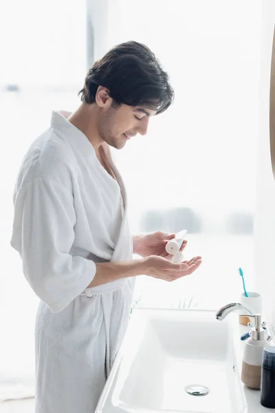 Side View Happy Man Bathrobe Applying Hand Cream Toiletries Sink — Stock Photo, Image