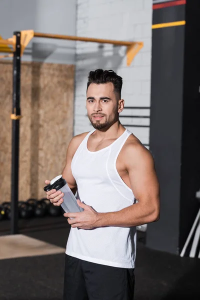 Smiling Sportsman Holding Sports Bottle Looking Camera Gym — Stock Photo, Image