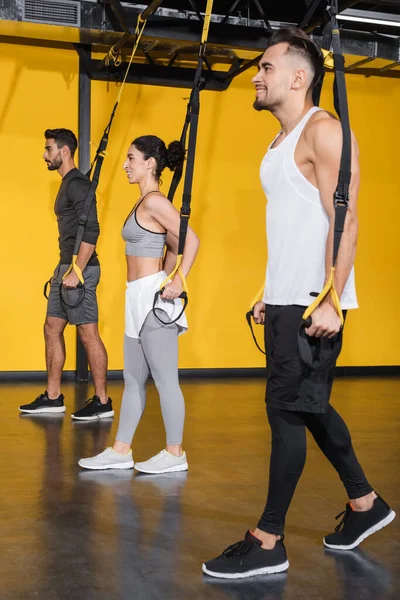 Smiling Interracial People Pulling Suspension Straps Gym — Stock Photo, Image