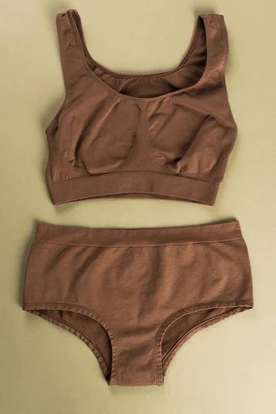 Top View Brown Cotton Underwear Green Background — Stock Photo, Image