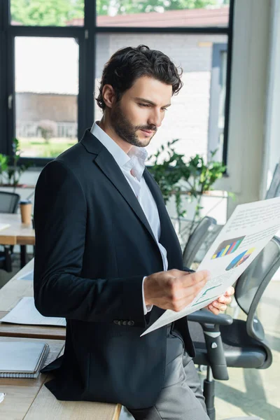 Bearded Businessman Black Blazer Looking Charts While Standing Office — Stock Photo, Image