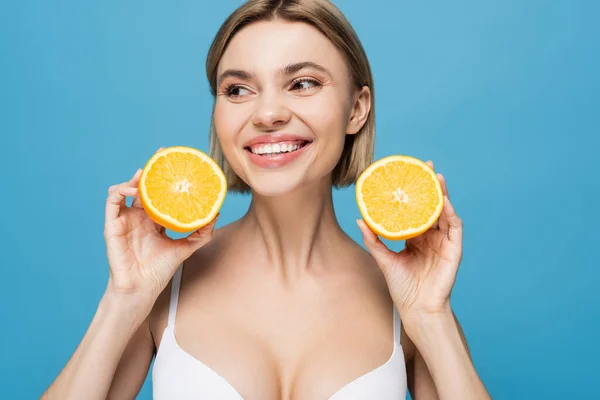 Cheerful Young Woman White Bra Holding Orange Halves Isolated Blue — Stock Photo, Image