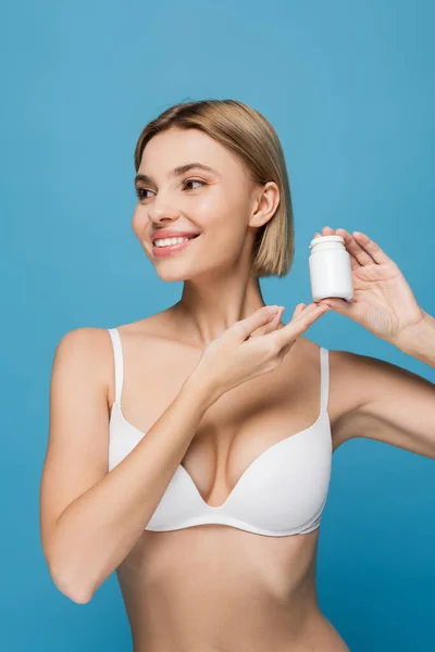 Happy Young Woman White Bra Holding Bottle Vitamins Isolated Blue — Stock Photo, Image