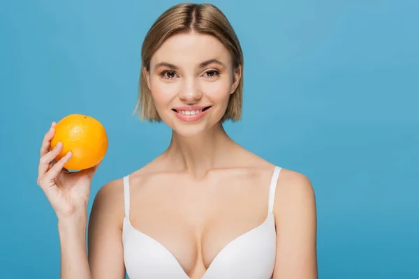 Joyful Young Woman White Bra Holding Ripe Orange Isolated Blue — Stock Photo, Image