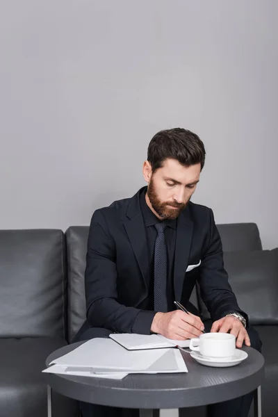 Bearded Man Suit Writing Notebook Documents Hotel Room — Stock Photo, Image