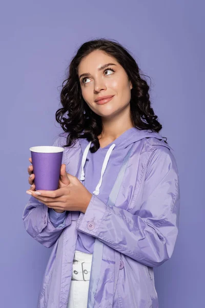 Happy Young Woman Raincoat Holding Paper Cup Isolated Purple — Stock Photo, Image