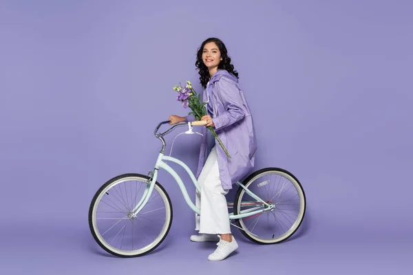 Full Length Cheerful Young Woman Violet Raincoat Riding Bicycle Holding — Stock Photo, Image
