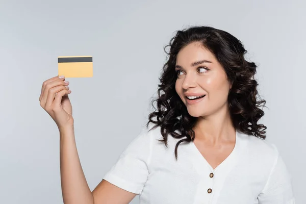 Pleased Young Woman Looking Credit Card Isolated Grey — Stock Photo, Image