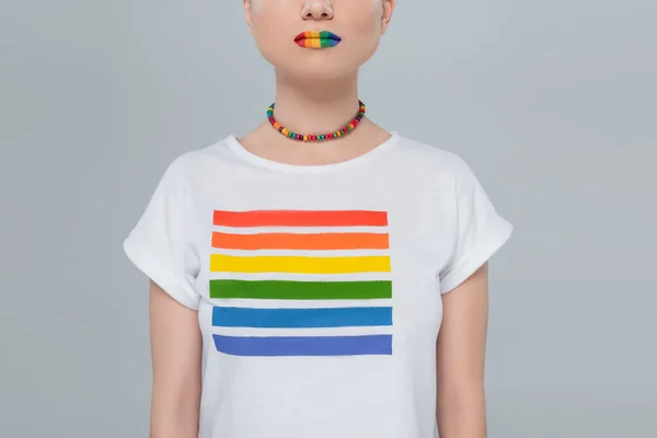 cropped view of woman in necklace and t-shirt with rainbow colors isolated on grey