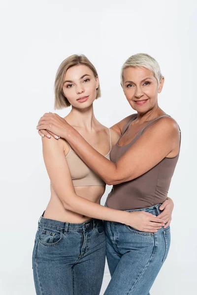 Women Jeans Hugging Looking Camera Isolated Grey Feminism Concept — Stock Photo, Image