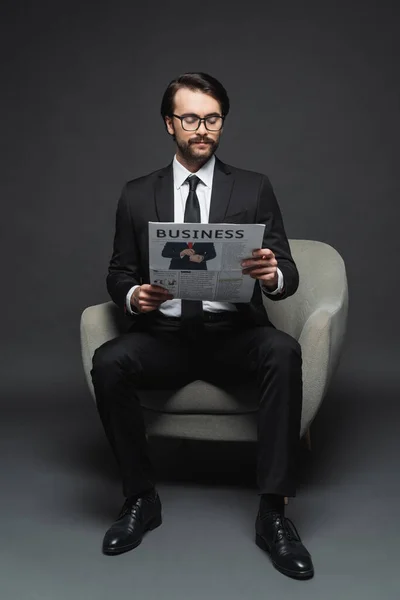 Full Length Businessman Suit Glasses Sitting Armchair Reading Business Newspaper — Stock Photo, Image