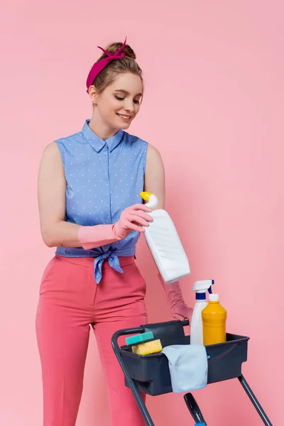 Cheerful Young Woman Rubber Gloves Standing Housekeeping Cart Holding Bottle — Stock Photo, Image