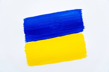 Beyaz zemin üzerinde boyanmış Ukrayna bayrağının üst görünümü 