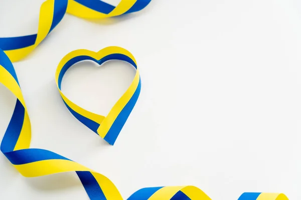 Top View Blue Yellow Ribbons Heart Shape White Background — Stock Photo, Image