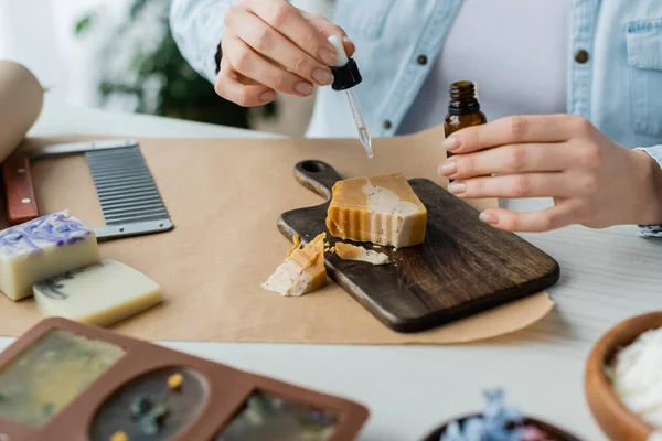 Cropped View Craftswoman Holding Bottle Essential Oil While Making Soap — Stock Photo, Image